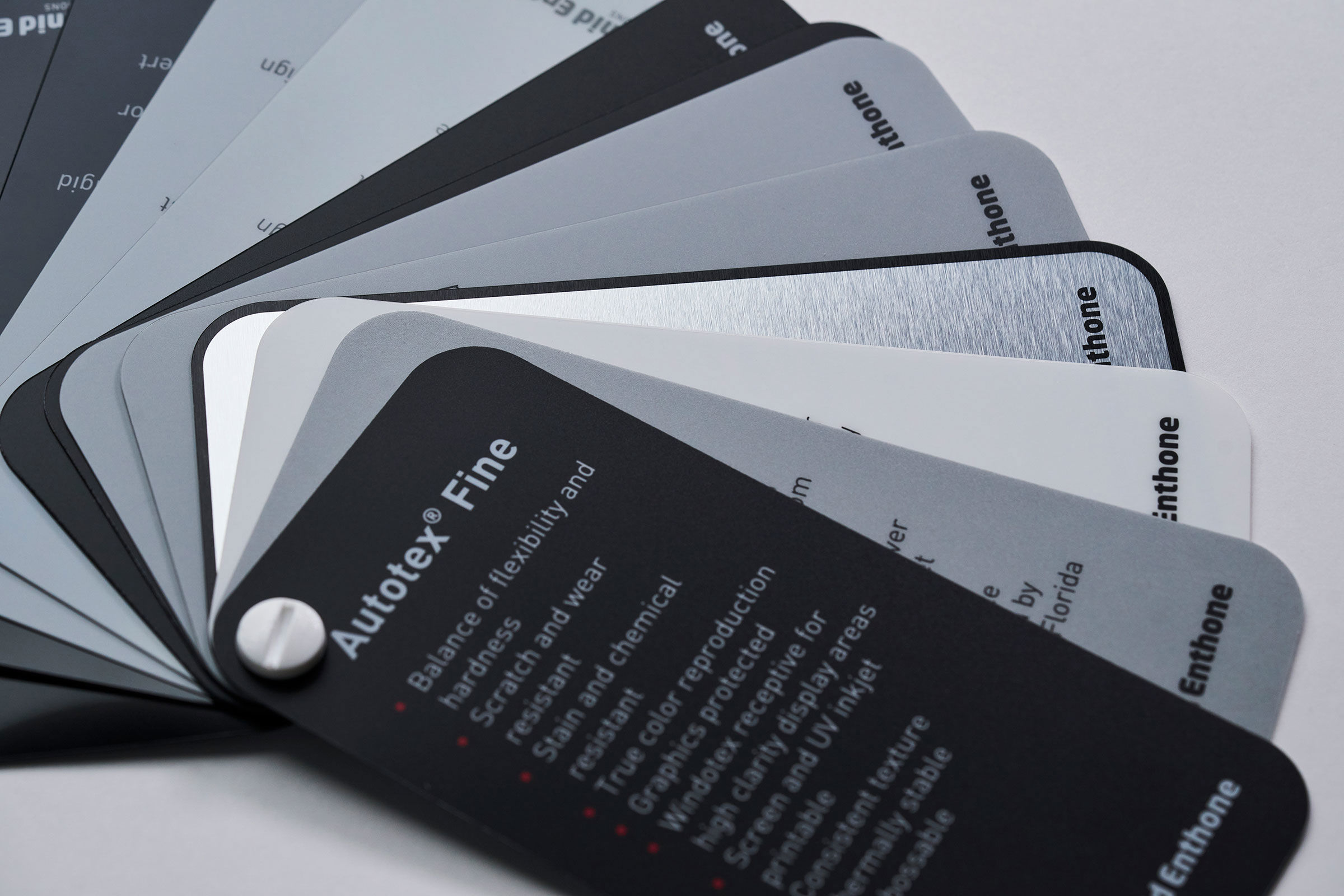 Different types of polyester materials for graphic overlays and front foils